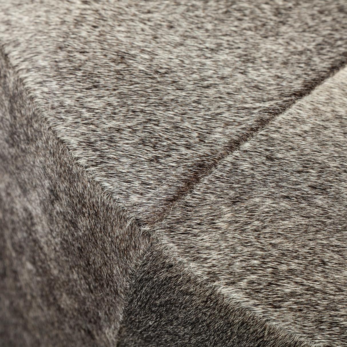 Zahavi I 23"H grey-toned hair-on-hide ottoman from Mercana - Luna Furniture