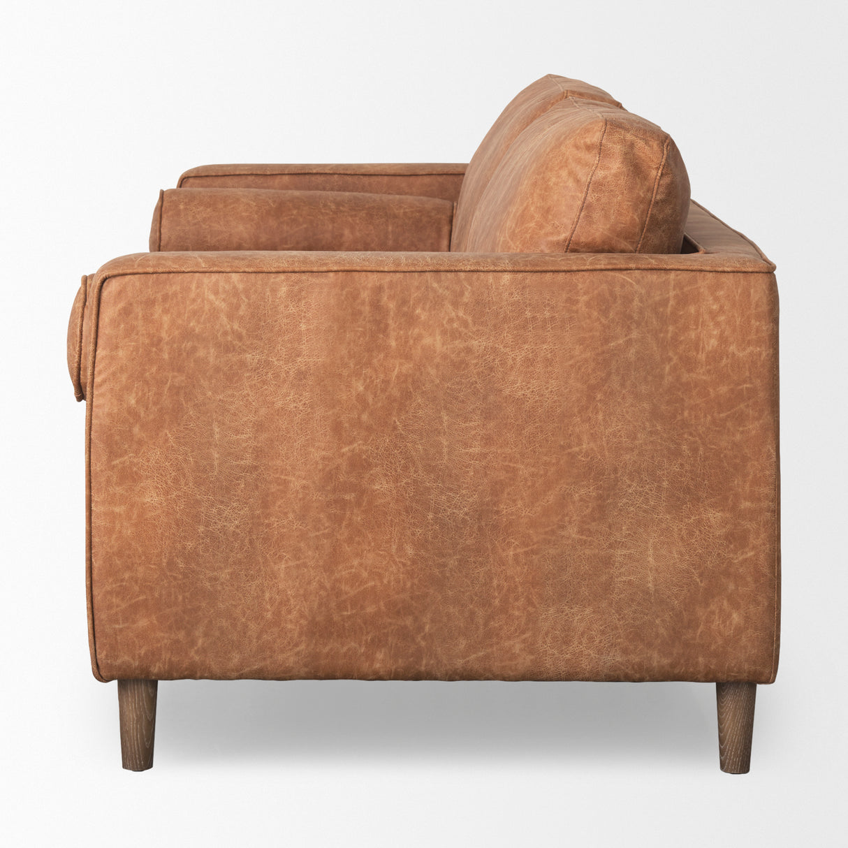 Loretta 88.0L x 36.2W x 33.9H Cognac Brown Faux Leather Three Seater Sofa with Two Bolster Cushions from Mercana - Luna Furniture