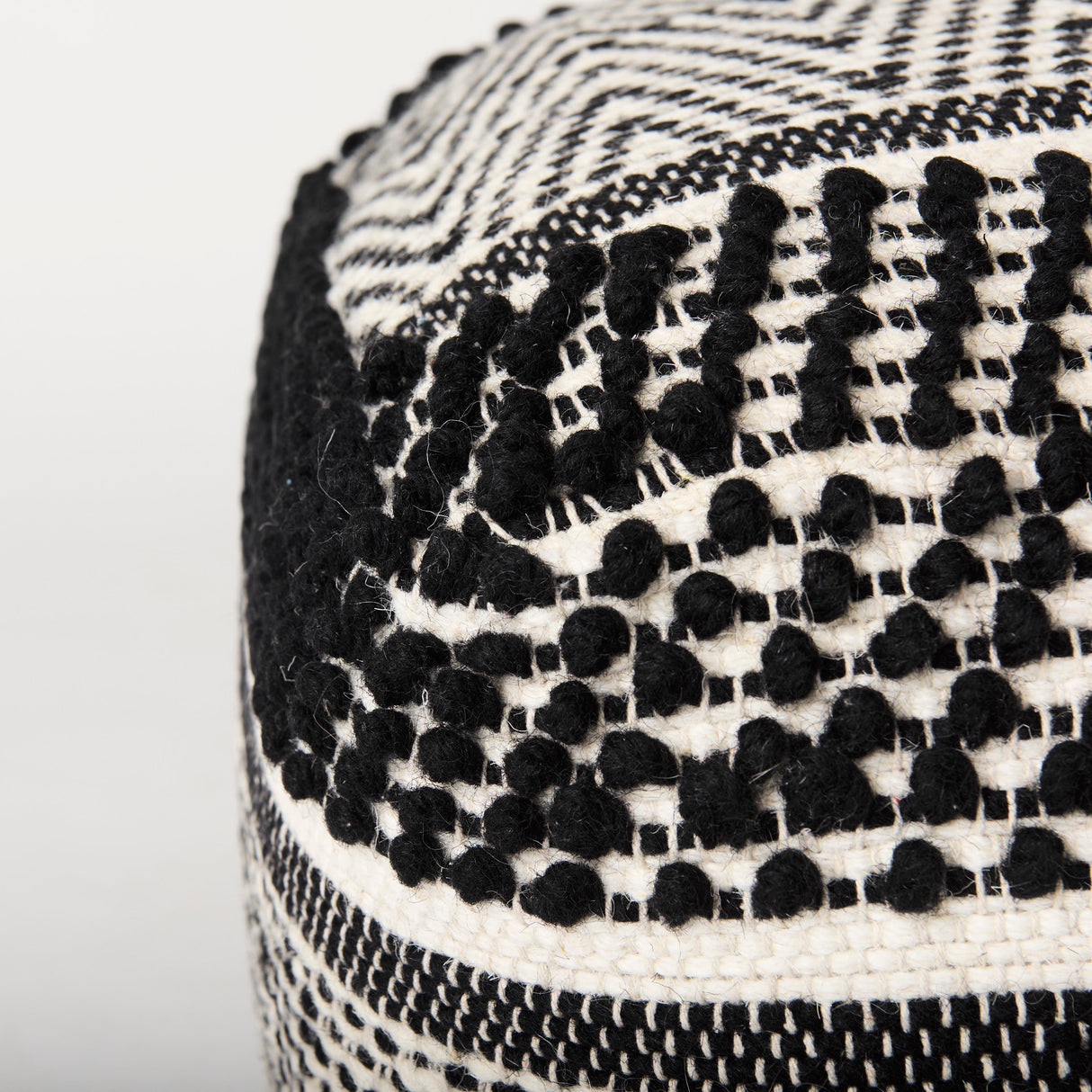 Garima 22.0L x 22.0W x 14.0H Black/White Wool and Cotton Patterned Pouf from Mercana - Luna Furniture