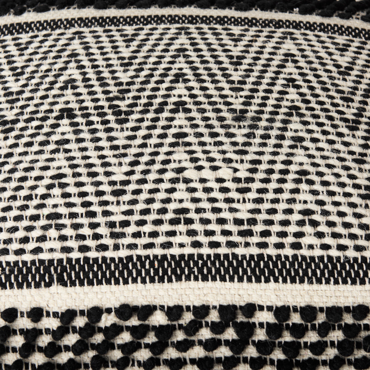 Garima 22.0L x 22.0W x 14.0H Black/White Wool and Cotton Patterned Pouf from Mercana - Luna Furniture