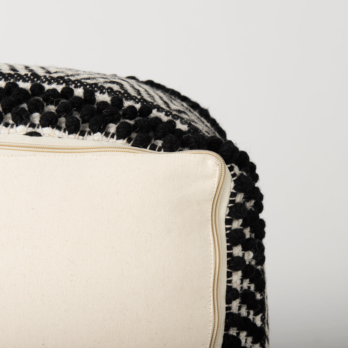 Garima 22.0L x 22.0W x 14.0H Black/White Wool and Cotton Patterned Pouf from Mercana - Luna Furniture