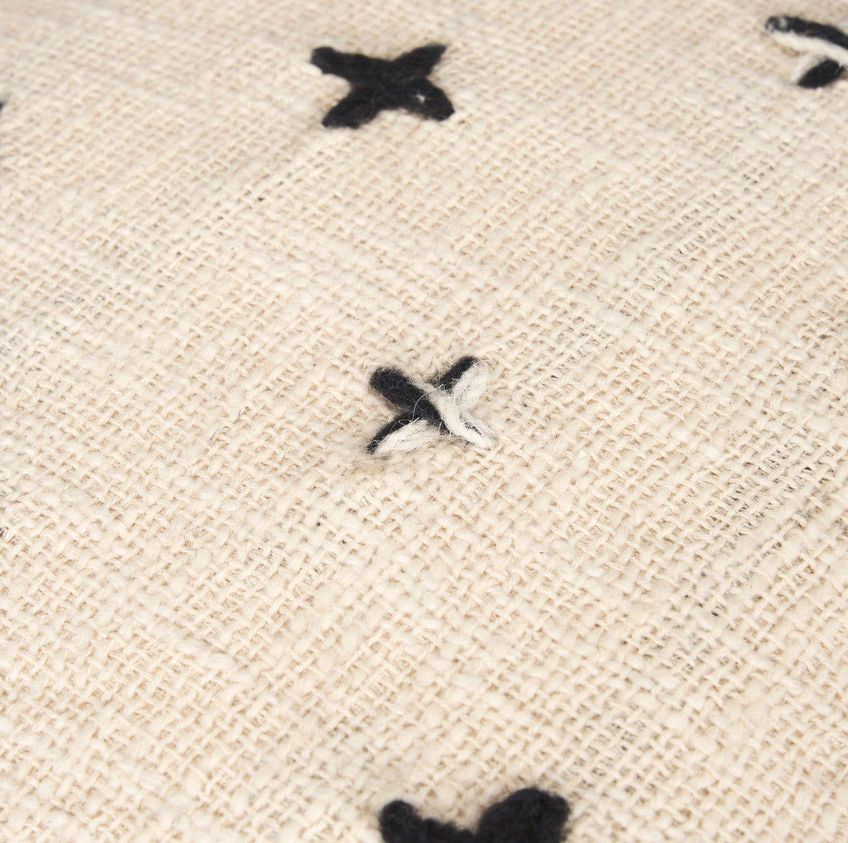 Saanvi Wool w/ Cream and Black Stitched Cross Patterned Pouf from Mercana - Luna Furniture