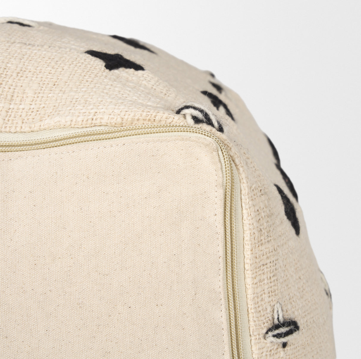 Saanvi Wool w/ Cream and Black Stitched Cross Patterned Pouf from Mercana - Luna Furniture
