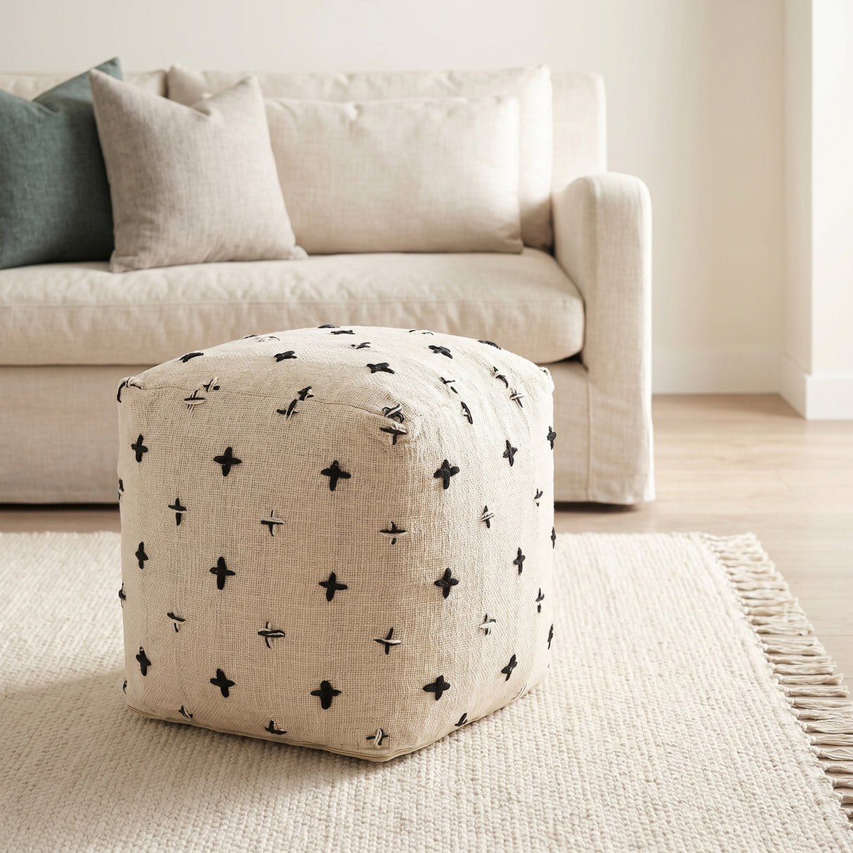 Saanvi Wool w/ Cream and Black Stitched Cross Patterned Pouf from Mercana - Luna Furniture