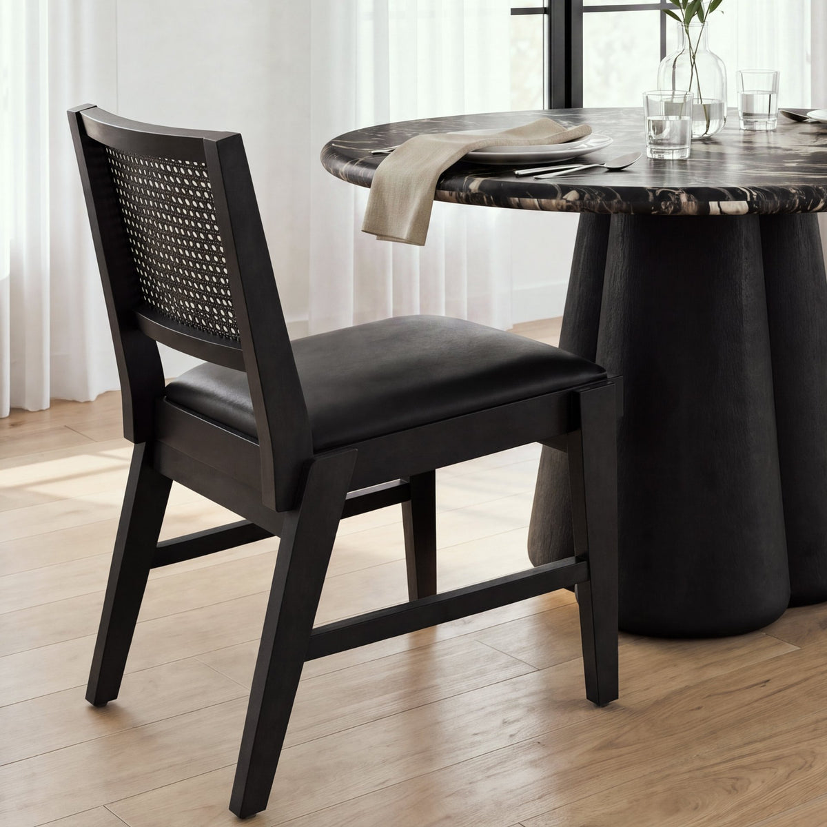 Reid Framed Black Cane Black Leather Dining Chair from Mercana - Luna Furniture
