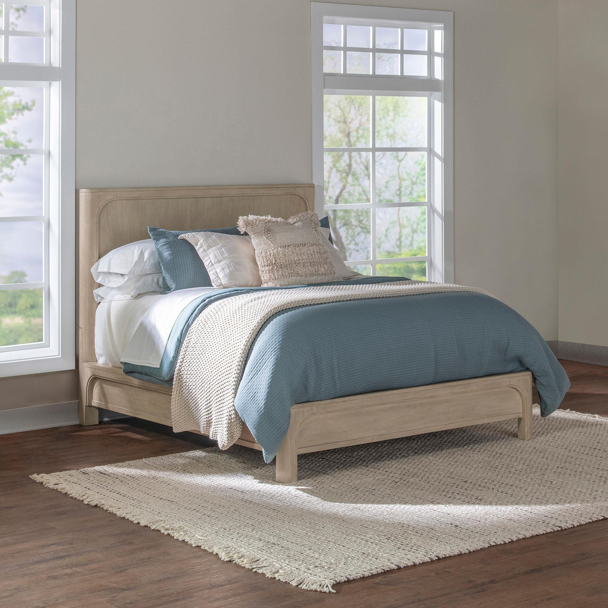 Solano Weathered California King Panel Bed, styled bedroom view with blue bedding and natural rug