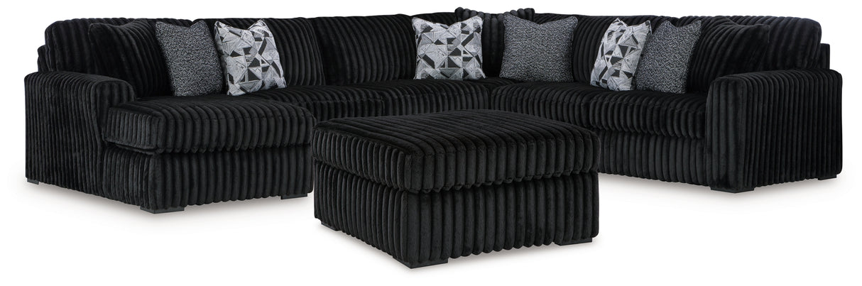 Midnight-Madness 4-Piece Sectional with Ottoman in Onyx from Ashley Furniture - Luna Furniture
