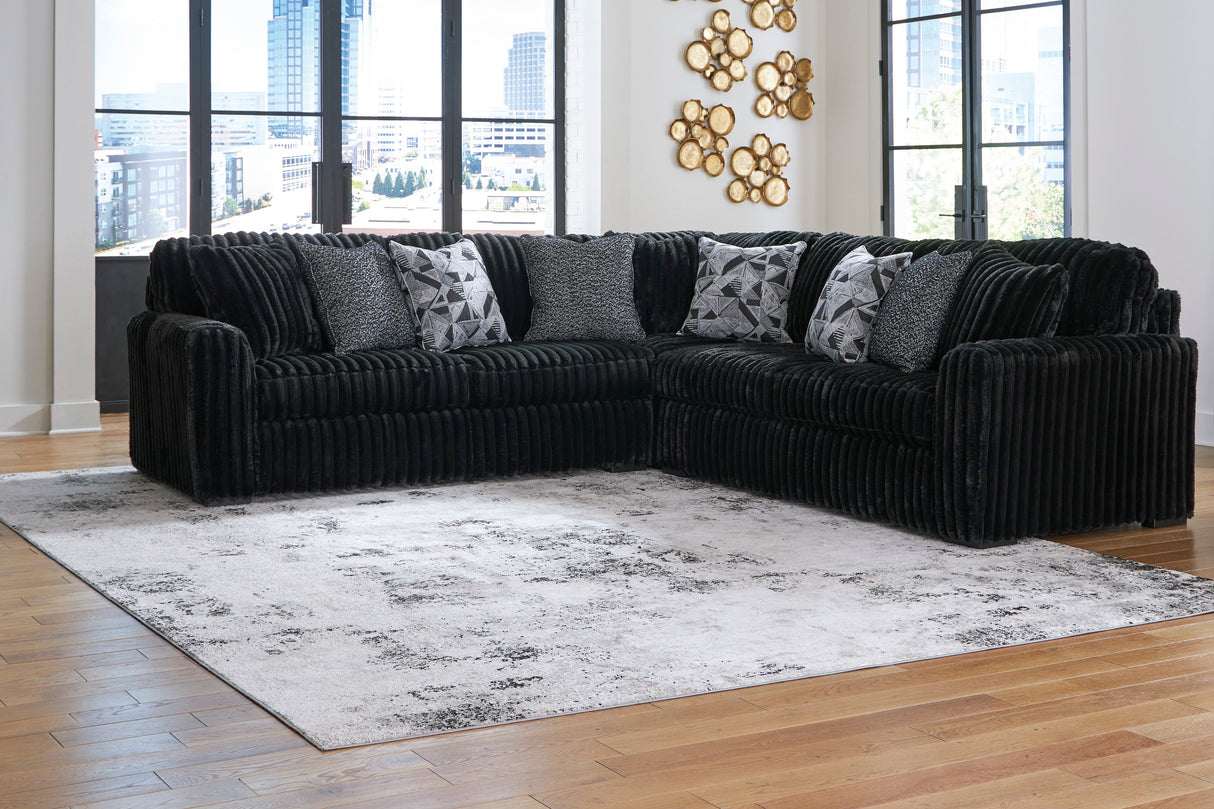 Midnight-Madness 3-Piece Sectional with Ottoman in Onyx from Ashley - Luna Furniture