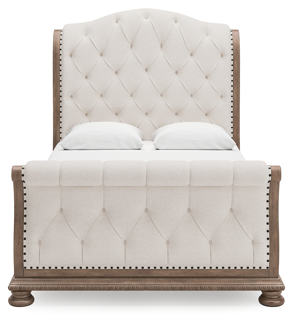 Ardenfield Queen Upholstered Sleigh Bed with Mirrored Dresser in Light Brown from Ashley Furniture - Luna Furniture
