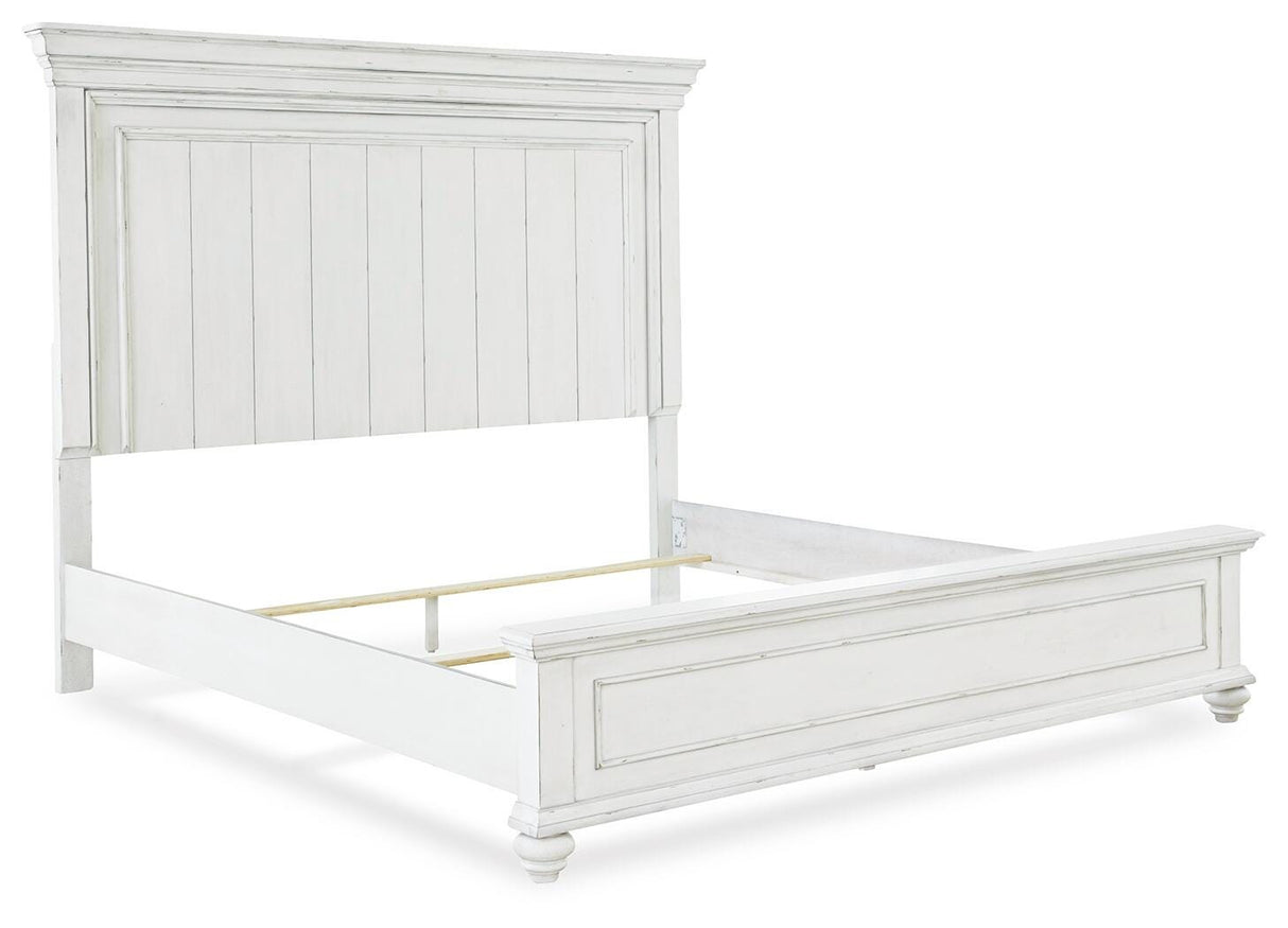 Kanwyn King Panel Bed with Mirrored Dresser, Chest and 2 Nightstands in Whitewash from Ashley - Luna Furniture