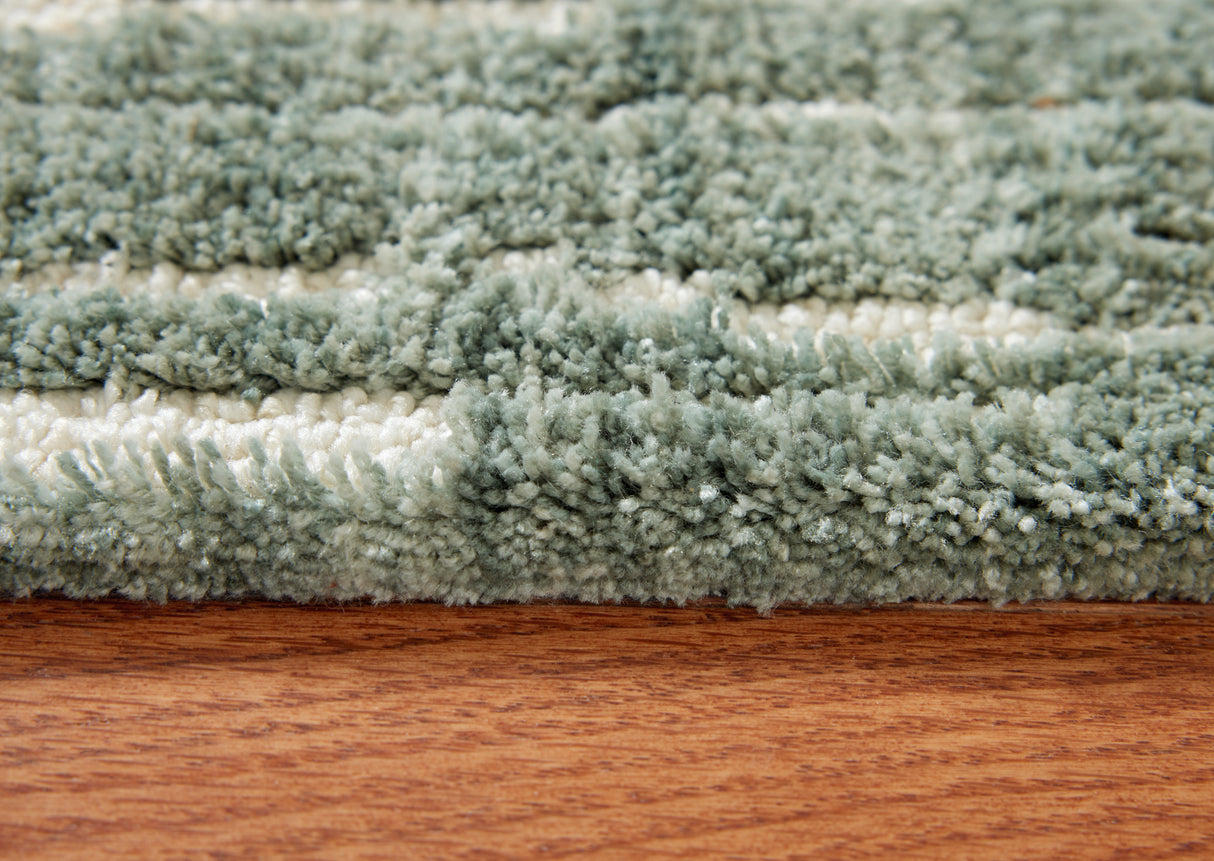 Cayworth Teal/White Medium Rug from Ashley Furniture - Luna Furniture