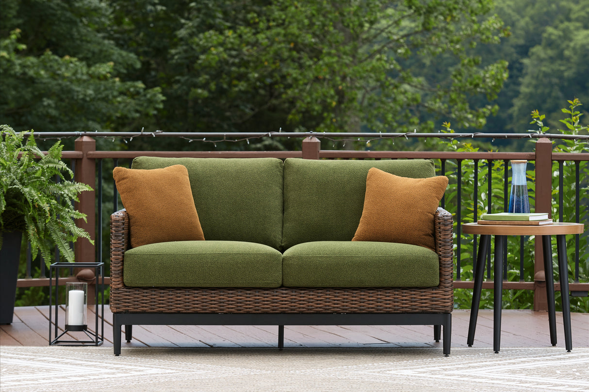 Horizon Hall Brown/Green Outdoor Loveseat with Cushion from Ashley Furniture - Luna Furniture