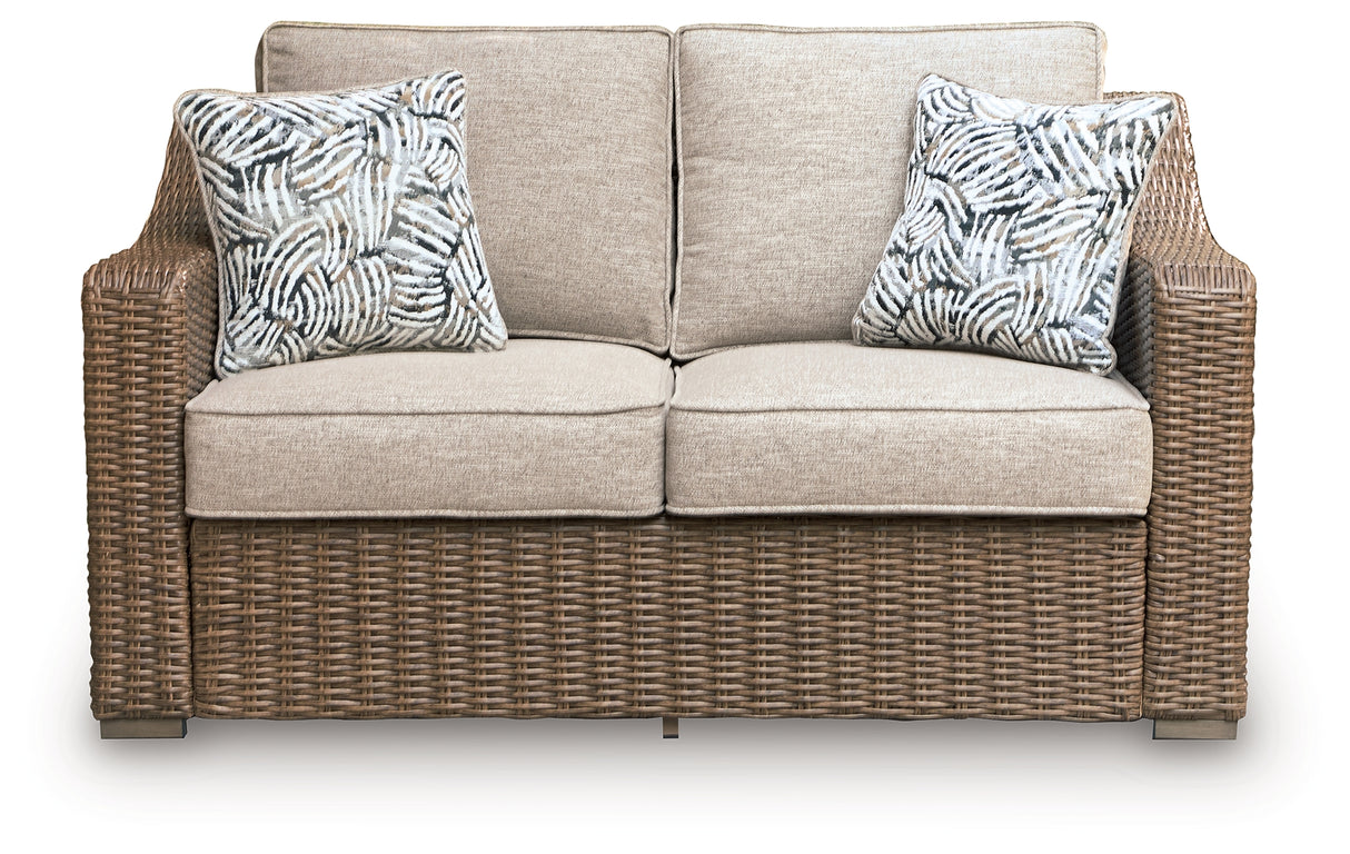 Laguna Heights Beige Outdoor Loveseat with Cushion from Ashley Furniture - Luna Furniture