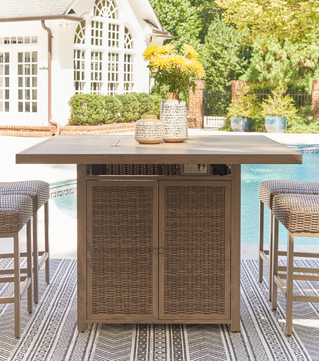 Walton Bridge Outdoor Bar Table and 4 Barstools in Driftwood from Ashley Furniture - Luna Furniture
