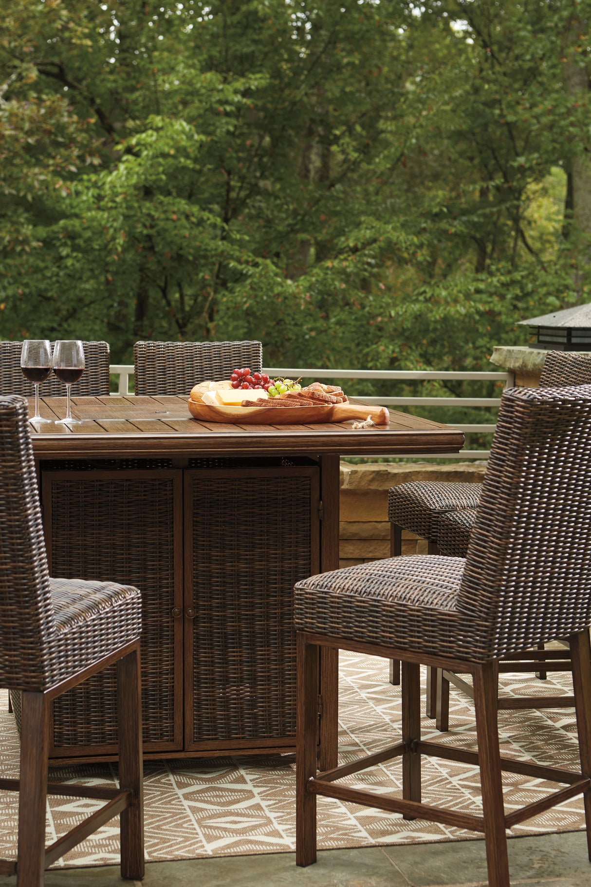 Paradise Trail Medium Brown Outdoor Counter Height Dining Table with 6 Barstools from Ashley Furniture - Luna Furniture