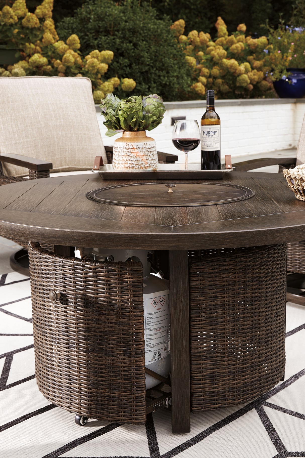 Paradise Trail Medium Brown Outdoor Fire Pit Table with 4 Lounge Chairs from Ashley Furniture - Luna Furniture