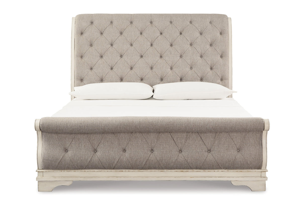 Realyn Chipped White California King Upholstered Sleigh Bed from Ashley - Luna Furniture