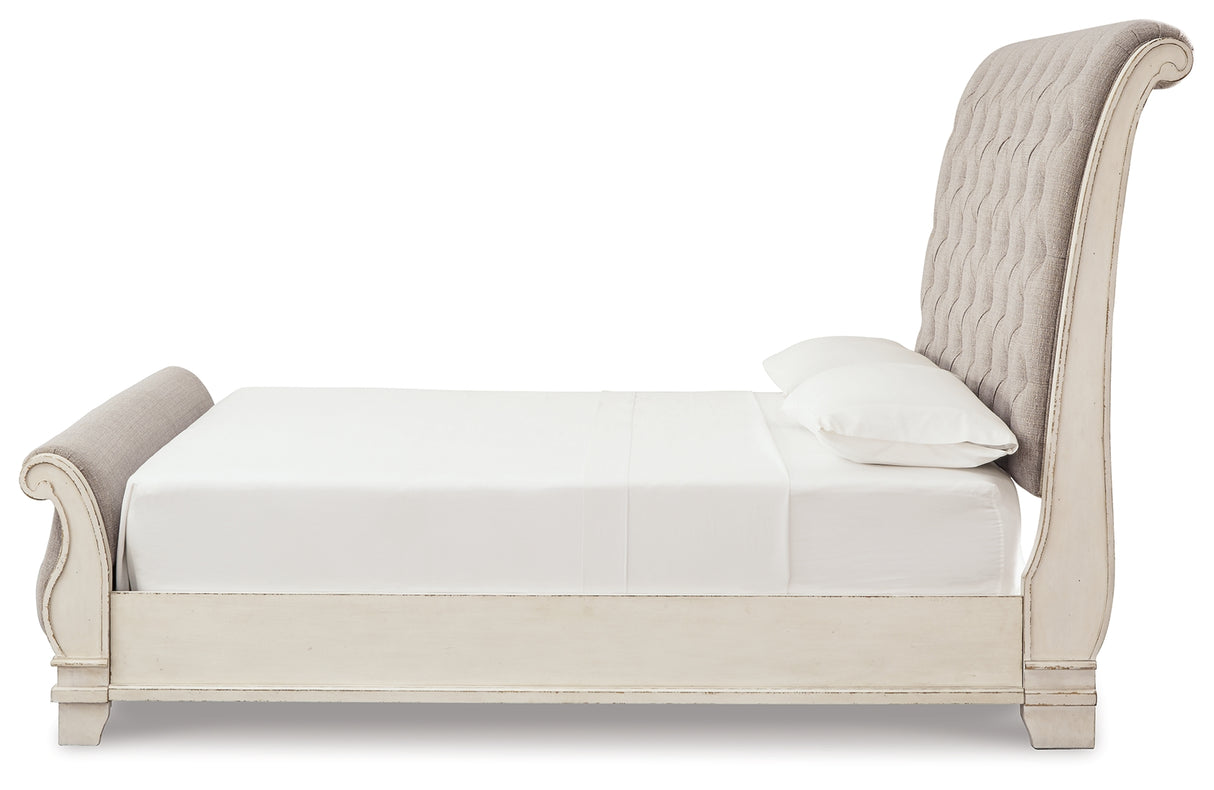Realyn Two-tone Queen Upholstered Sleigh Bed and Chest from Ashley Furniture - Luna Furniture
