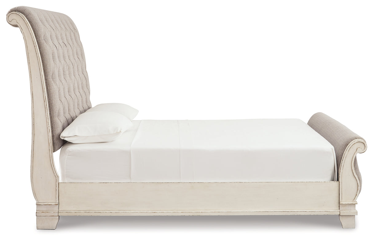 Realyn Two-tone Queen Upholstered Sleigh Bed and Chest from Ashley Furniture - Luna Furniture
