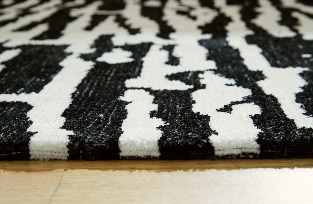 Bramshaw Black/Ivory Extra Large Rug from Ashley - Luna Furniture