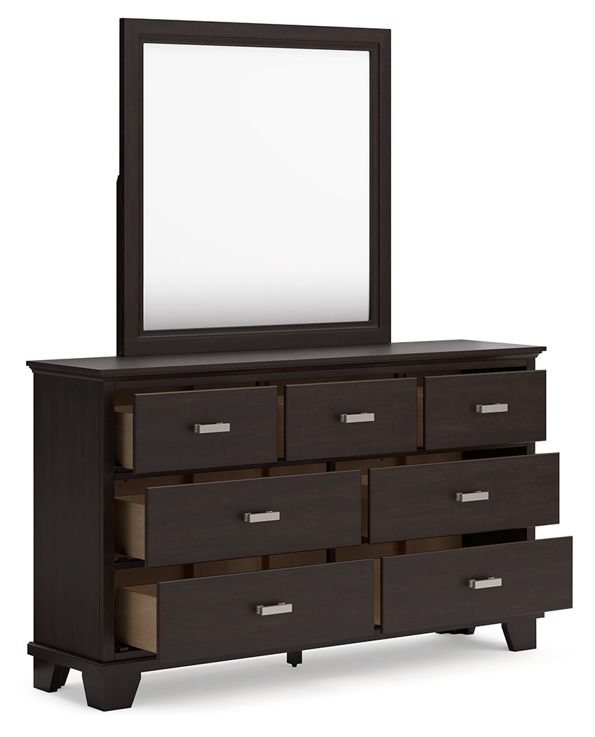 Covetown King Panel Bed with Mirrored Dresser, Chest and 2 Nightstands in Dark Brown from Ashley - Luna Furniture
