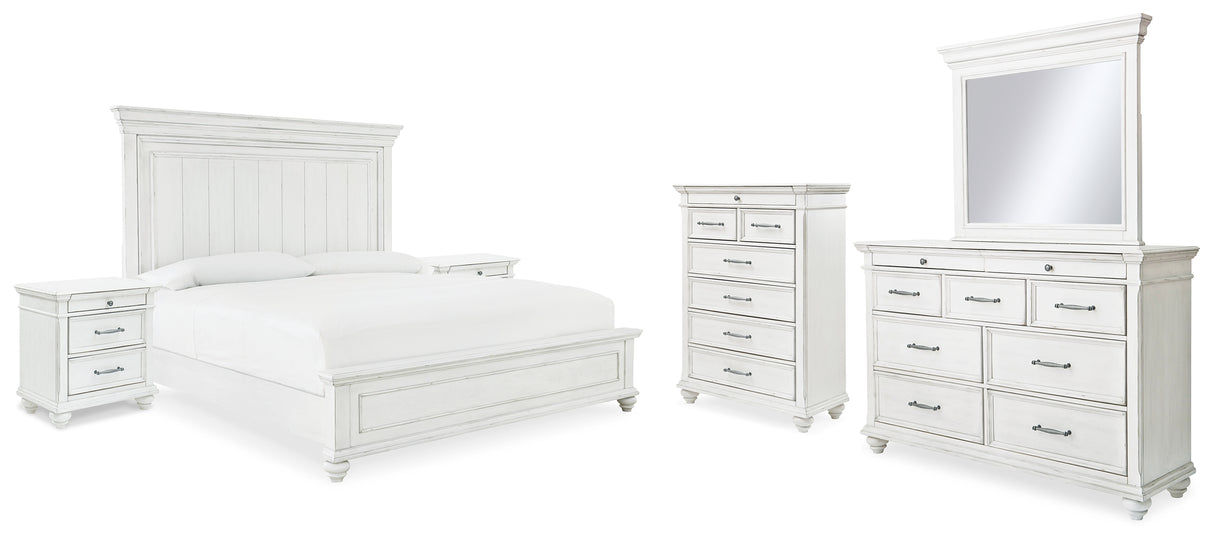 Kanwyn King Panel Bed with Mirrored Dresser, Chest and 2 Nightstands in Whitewash from Ashley - Luna Furniture
