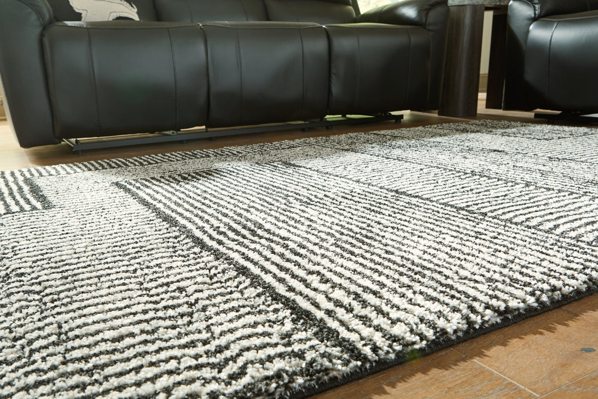 Kurtmen Black/Ivory Large Rug from Ashley Furniture - Luna Furniture