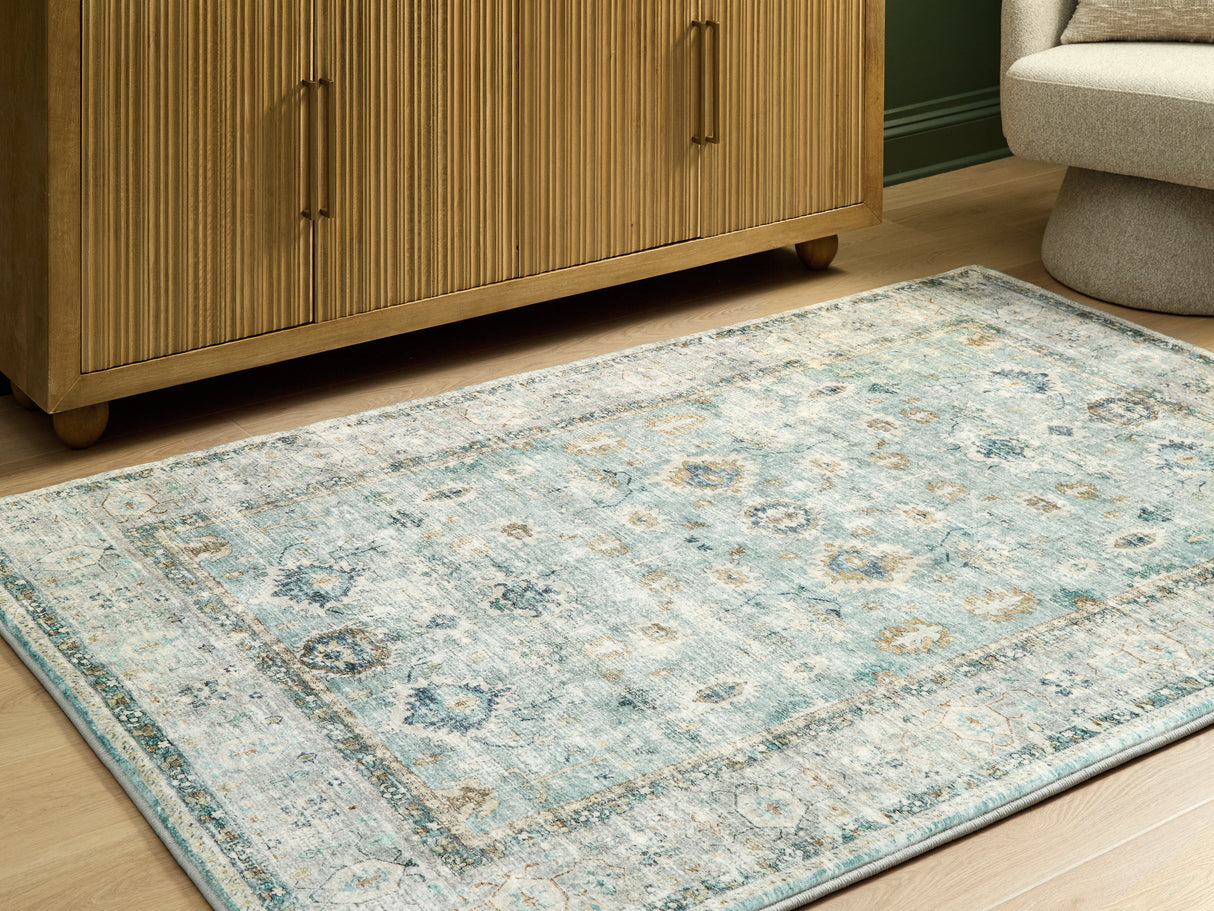 Ladstoney Teal/Beige/Ochre Medium Rug from Ashley Furniture - Luna Furniture