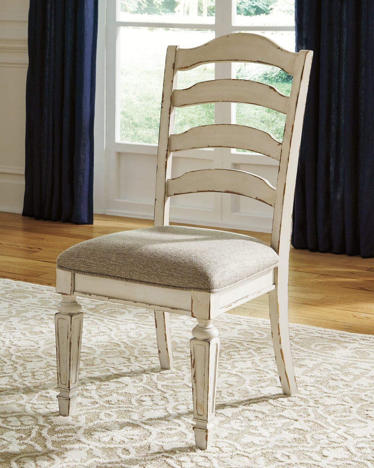 Realyn Dining Table and 8 Chairs in Chipped White from Ashley Furniture - Luna Furniture