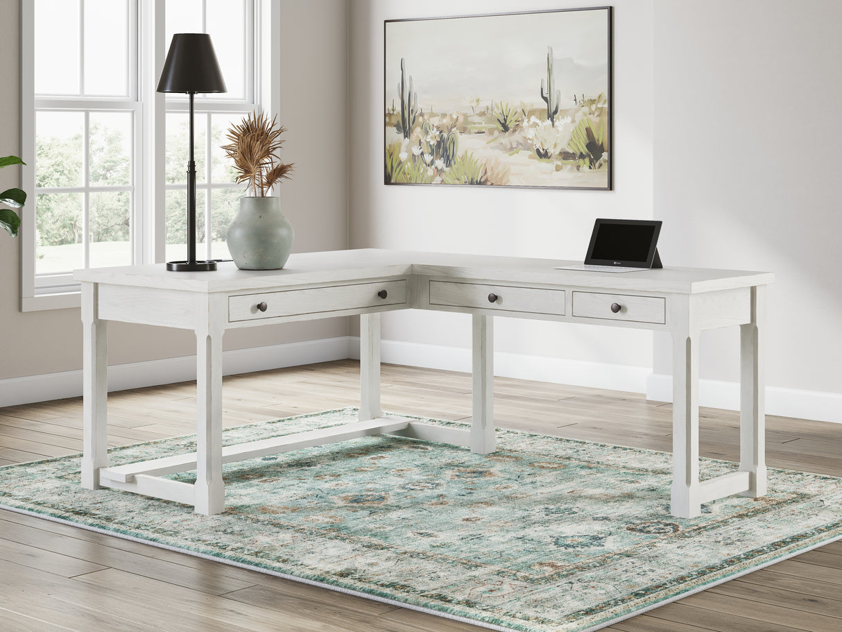 Robbinsdale Antique White L-Shaped Home Office Desk from Ashley - Luna Furniture