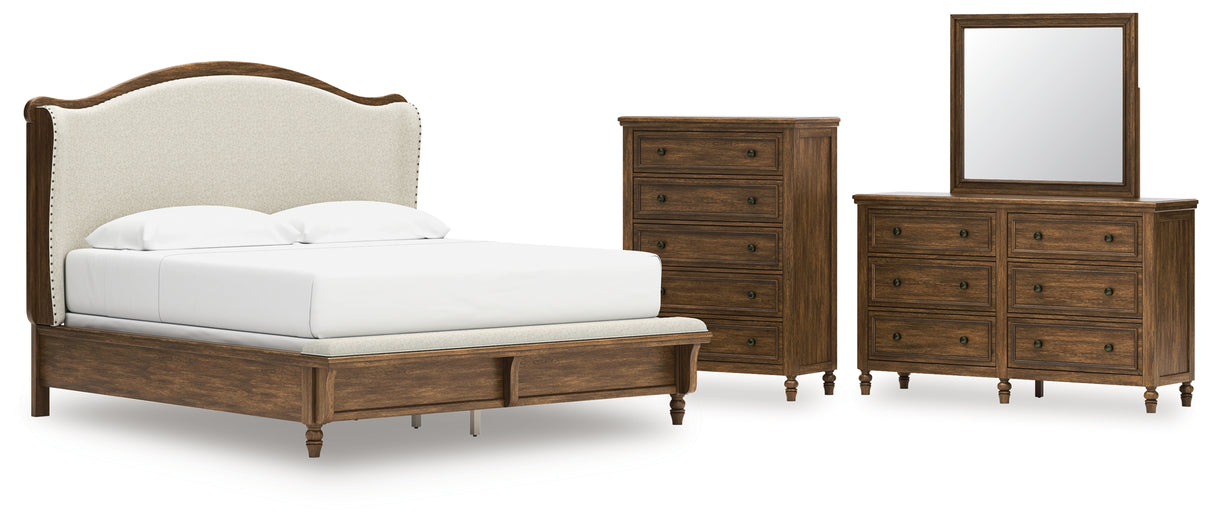 Sturlayne King Upholstered Panel Bed with Mirrored Dresser and Chest in Brown from Ashley - Luna Furniture