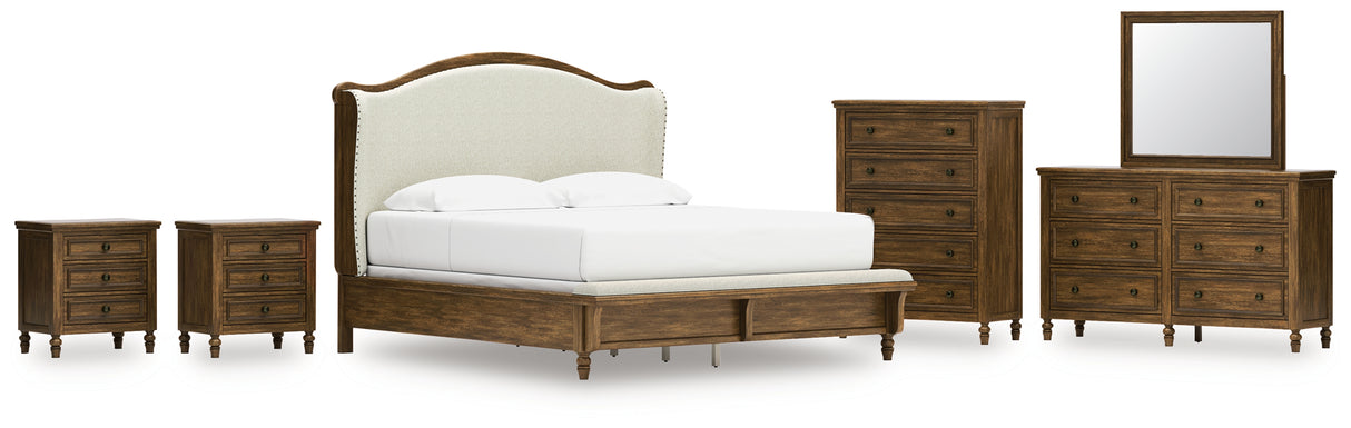 Sturlayne King Upholstered Panel Bed with Mirrored Dresser, Chest and 2 Nightstands in Brown from Ashley - Luna Furniture
