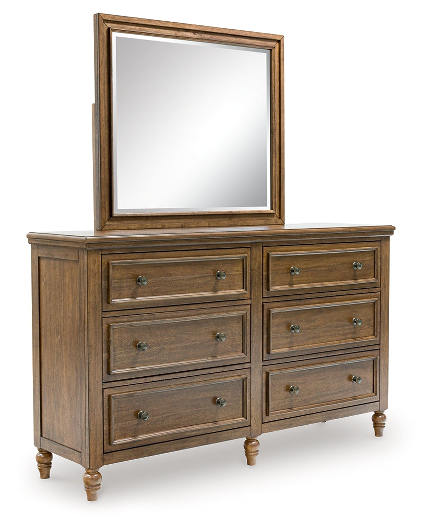 Sturlayne Queen Upholstered Panel Bed with Mirrored Dresser, Chest and 2 Nightstands in Brown from Ashley - Luna Furniture
