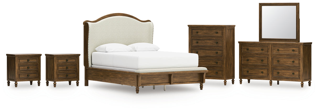 Sturlayne Queen Upholstered Panel Bed with Mirrored Dresser, Chest and 2 Nightstands in Brown from Ashley - Luna Furniture