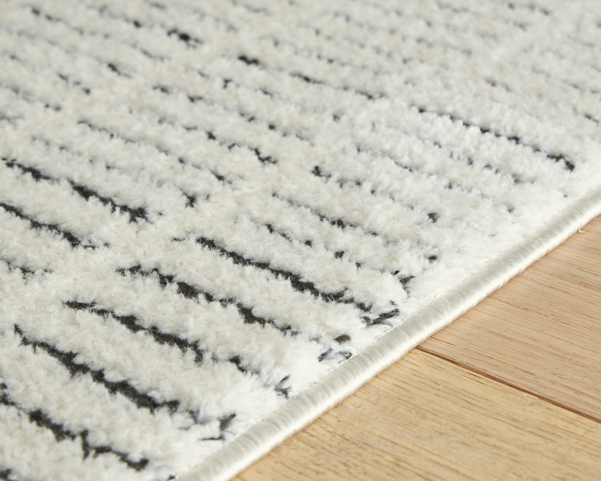 Turinwith Ivory/Black Large Rug from Ashley - Luna Furniture