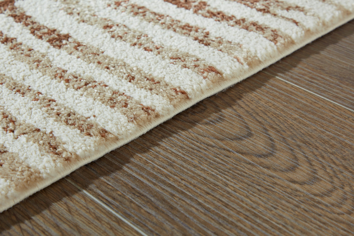 Uduak Cream/Tan/Rust Large Rug from Ashley - Luna Furniture