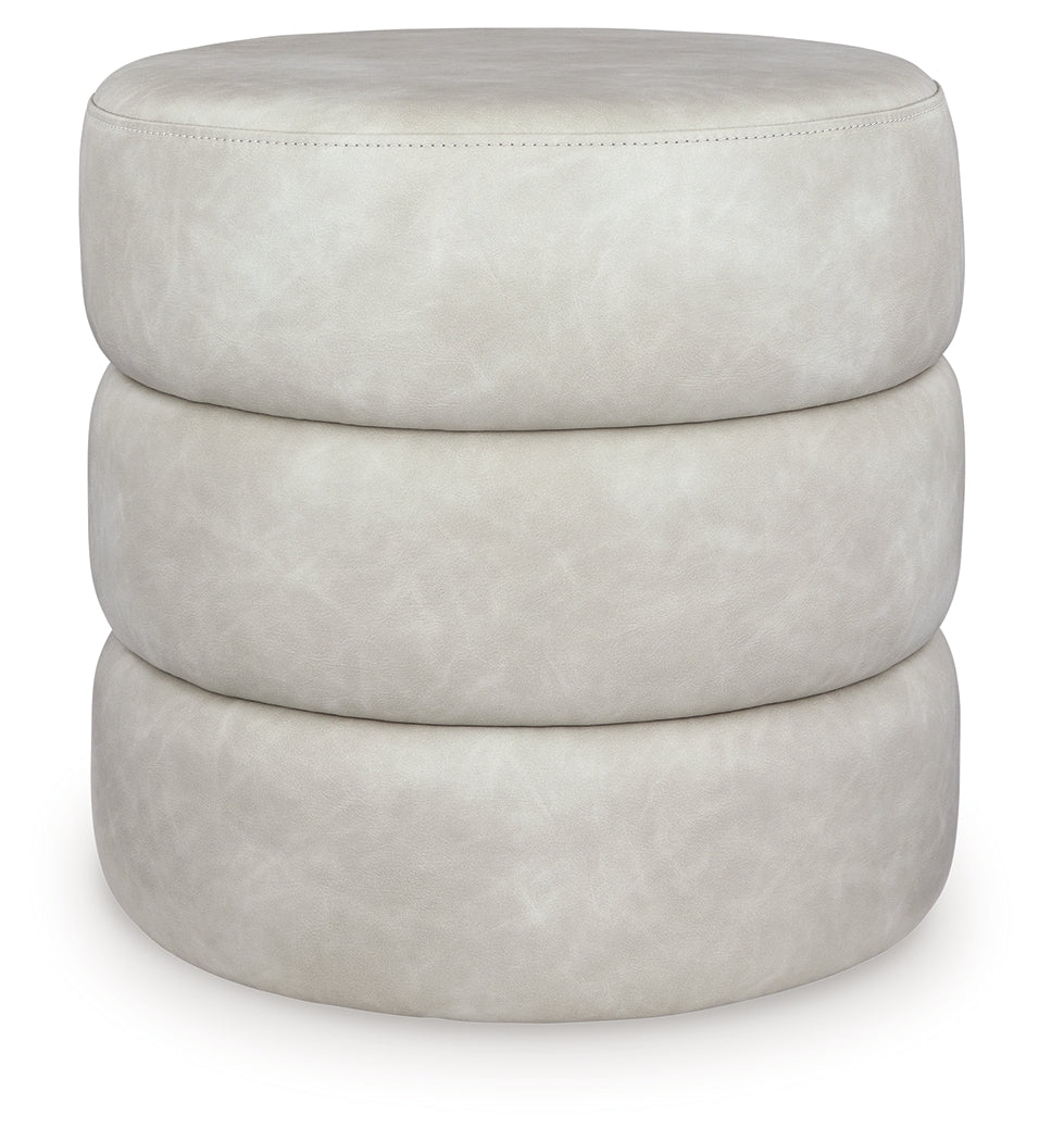 Ummi Bone Swivel Accent Ottoman from Ashley - Luna Furniture