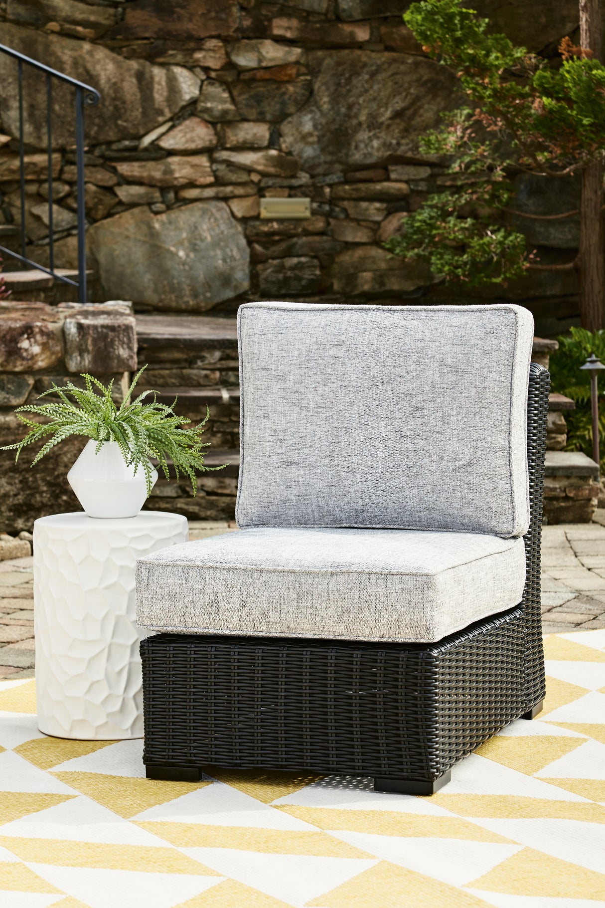 Beachcroft Black/Light Gray Outdoor Armless Chair with Cushion from Ashley Furniture - Luna Furniture