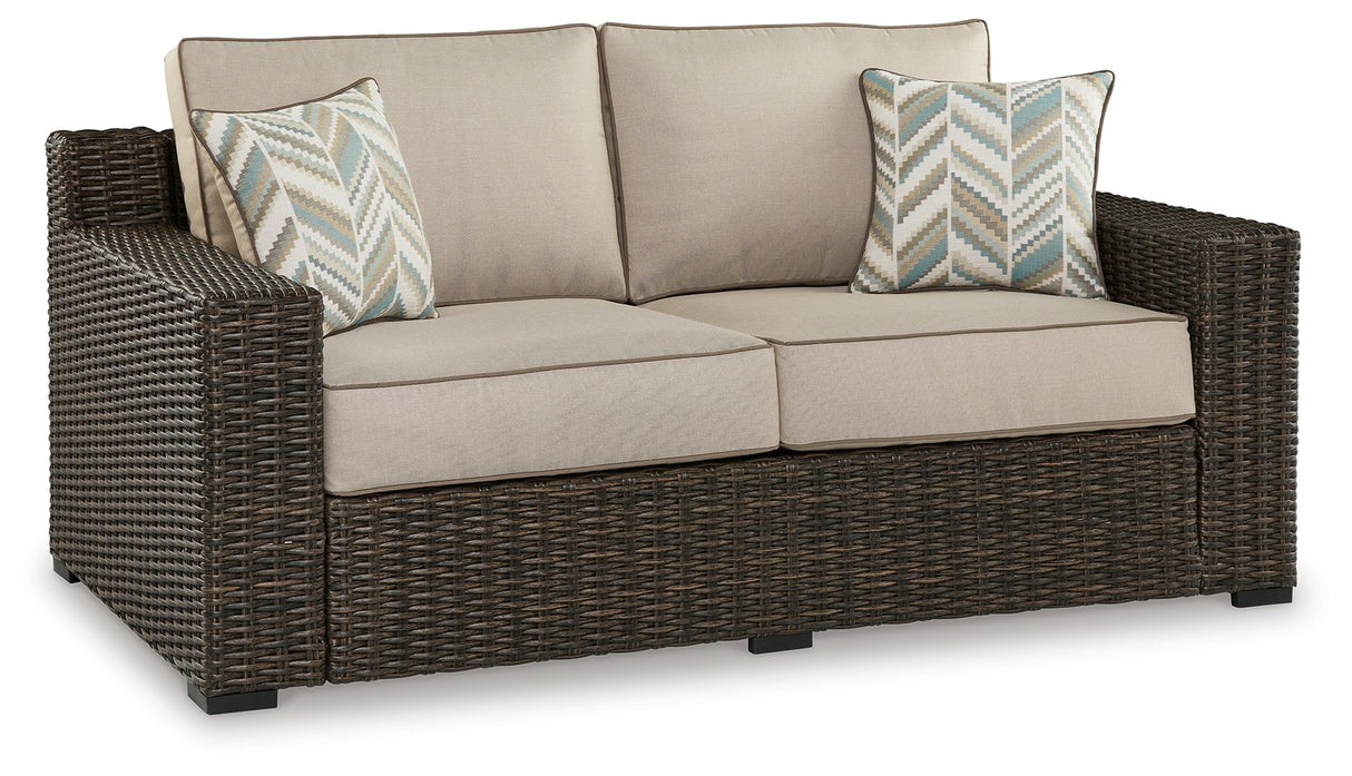Coastline Bay Brown Outdoor Loveseat with Cushion from Ashley - Luna Furniture