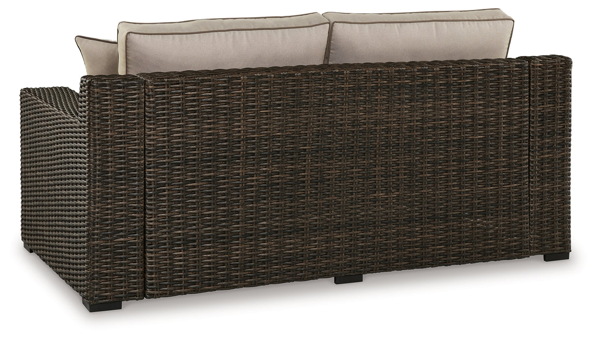 Coastline Bay Brown Outdoor Loveseat with Cushion from Ashley - Luna Furniture