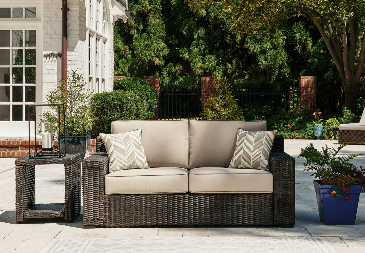 Coastline Bay Brown Outdoor Loveseat with Cushion from Ashley - Luna Furniture
