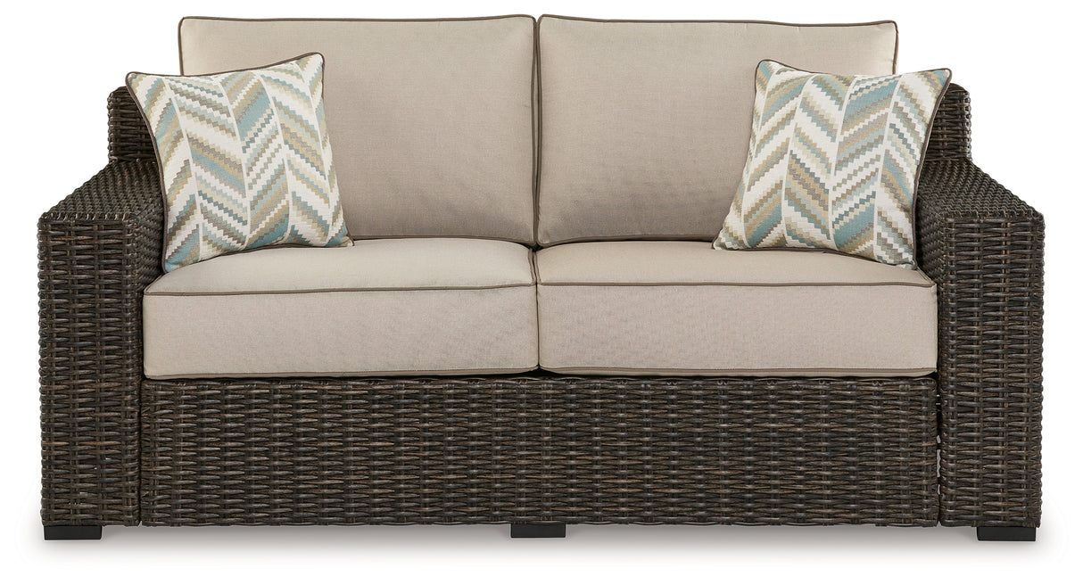 Coastline Bay Brown Outdoor Loveseat with Cushion from Ashley - Luna Furniture