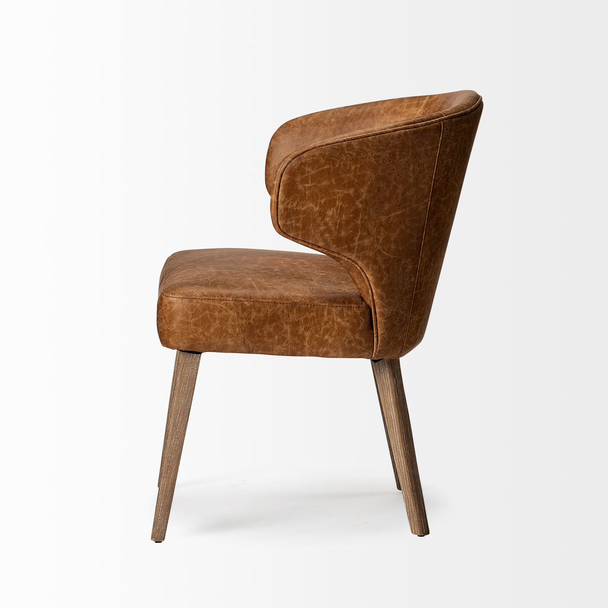 Niles 22.5L x 24.0W x 32.0H Brown Faux Leather Seat W/Brown Wooden Legs Wingback Dining Chair from Mercana - Luna Furniture