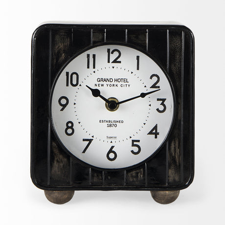Karl 6.0L x 3.0W x 6.8H Rustic Black Iron Rounded Square Table Clock from Mercana - Luna Furniture