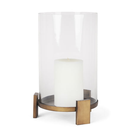 Price Large Antiqued Gold Metal w/ Glass Hurricane Candle Holder from Mercana - Luna Furniture