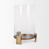 Price Large Antiqued Gold Metal w/ Glass Hurricane Candle Holder from Mercana - Luna Furniture
