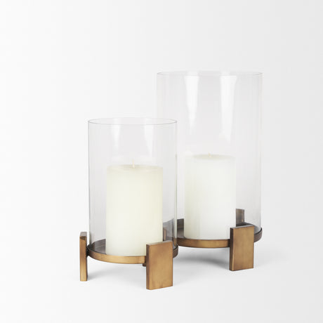 Price Large Antiqued Gold Metal w/ Glass Hurricane Candle Holder from Mercana - Luna Furniture