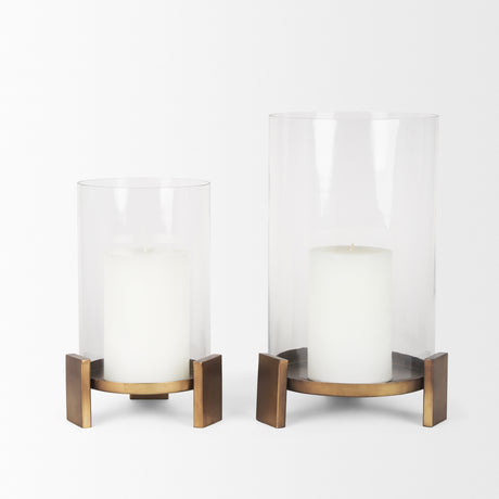 Price Large Antiqued Gold Metal w/ Glass Hurricane Candle Holder from Mercana - Luna Furniture
