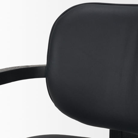 Carlisle Curved Back Black Leather Tripod Frame Dining Armchair from Mercana - Luna Furniture