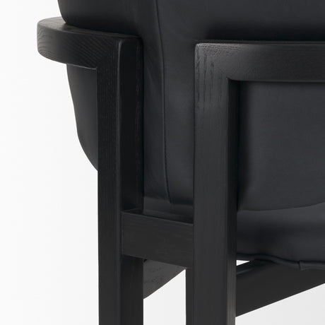 Carlisle Curved Back Black Leather Tripod Frame Dining Armchair from Mercana - Luna Furniture
